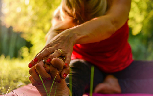 Sciatic nerve pain relief using the sitting pigeon yoga pose